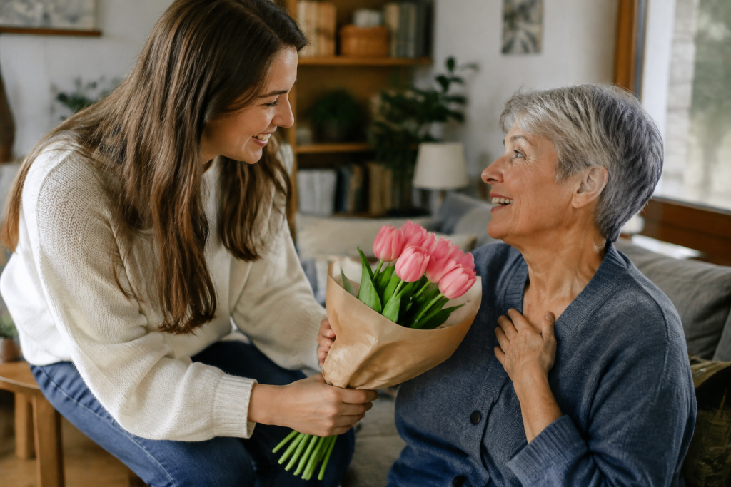 Jeune femme offrant des tulipes roses a sa mere